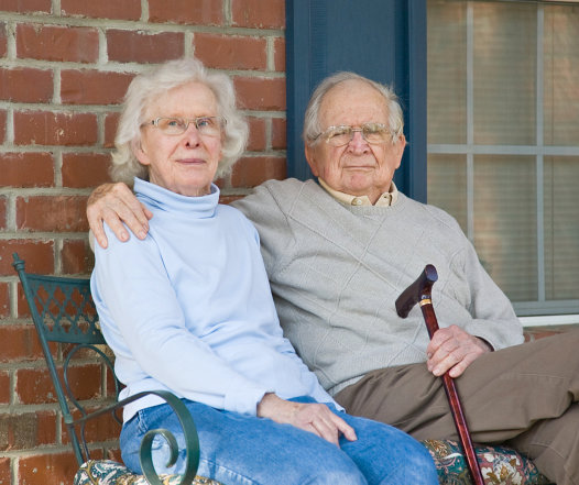 loving couple sitting beside the window