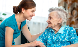 lovely grandma smiling with her caregiver